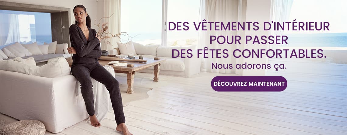 Des vêtements d'intérieur pour passer des fêtes confortables – Personne assise en tenue décontractée dans un salon lumineux. Découvrez maintenant